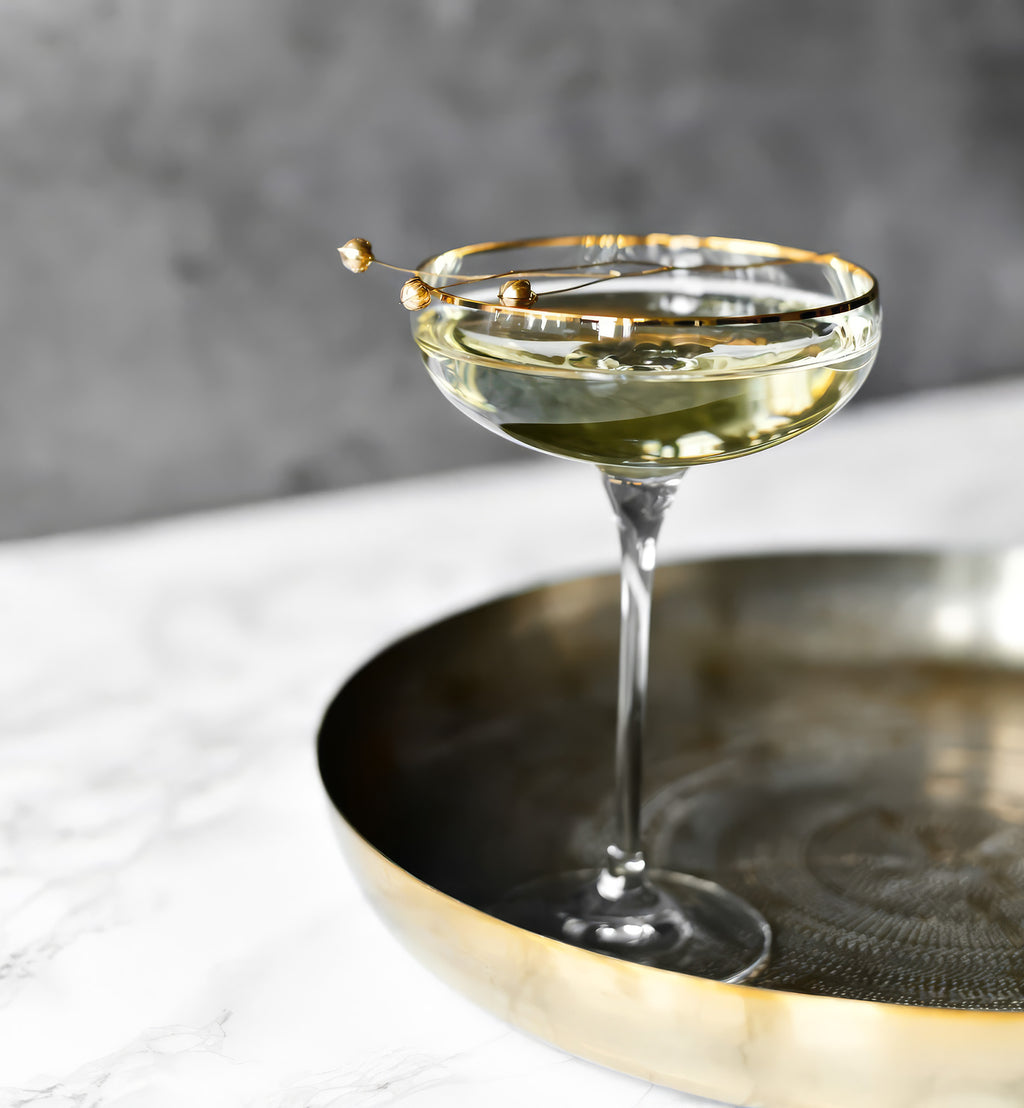 Flat champagne glasses with a gold rim Harmony